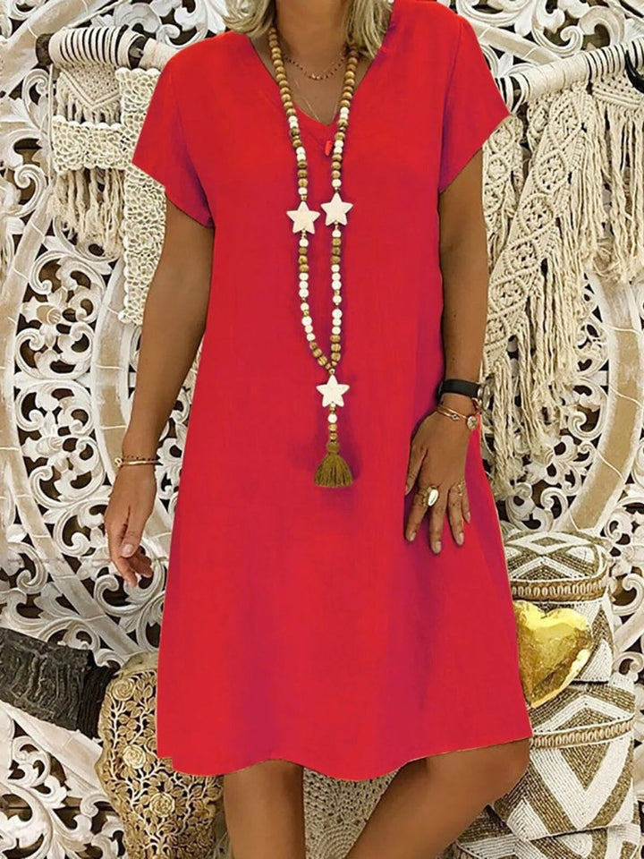 Stylish Red V-neck A-line mini dress for women. Short sleeve, comfortable, perfect casual summer look.