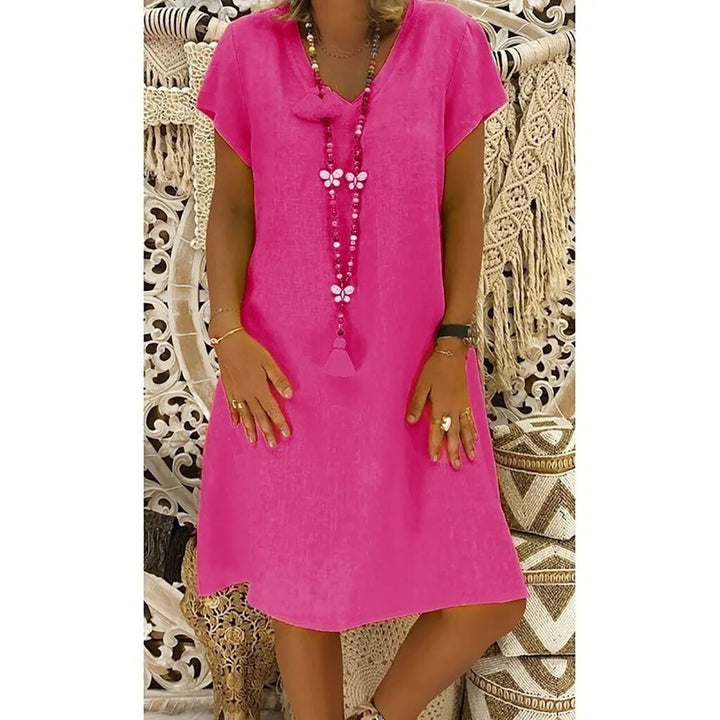 Pretty Pink Women's V-neck A-line mini dress. Short sleeve, versatile, great for casual summer days.