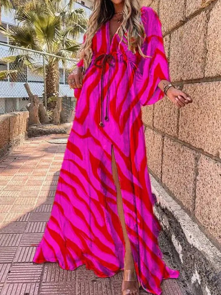 Elegant women's V-neck abstract print flowy maxi dress with kimono sleeves, ideal for casual summer occasions.