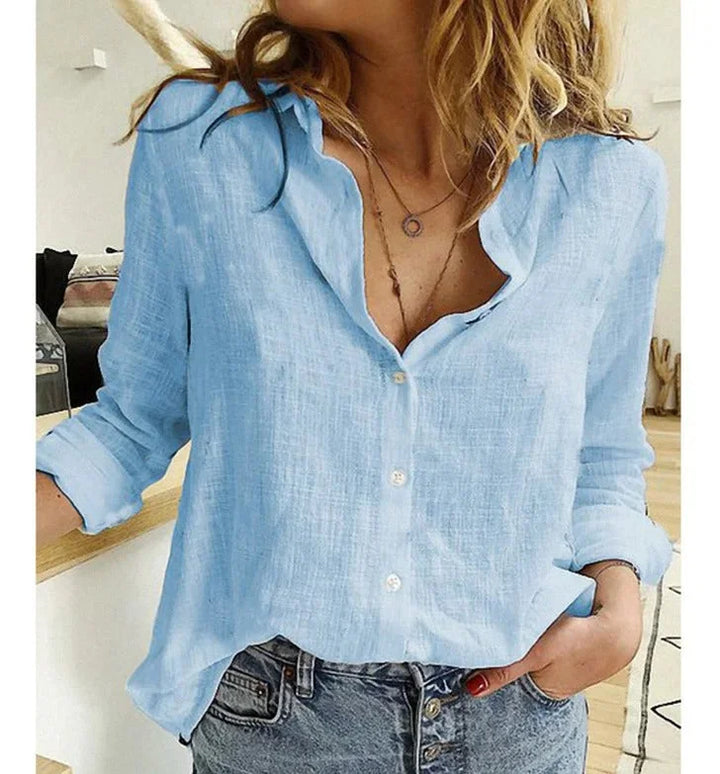 Casual relaxed fit women's V-neck blouse, button-down front, perfect for everyday style.