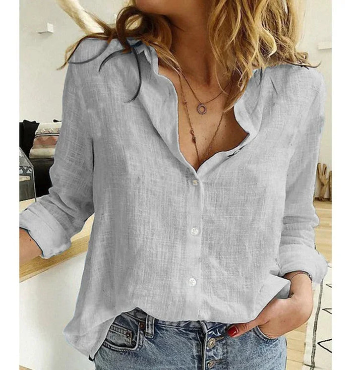 Women's button-down blouse with a flattering V-neck, long sleeves, great for work or casual.