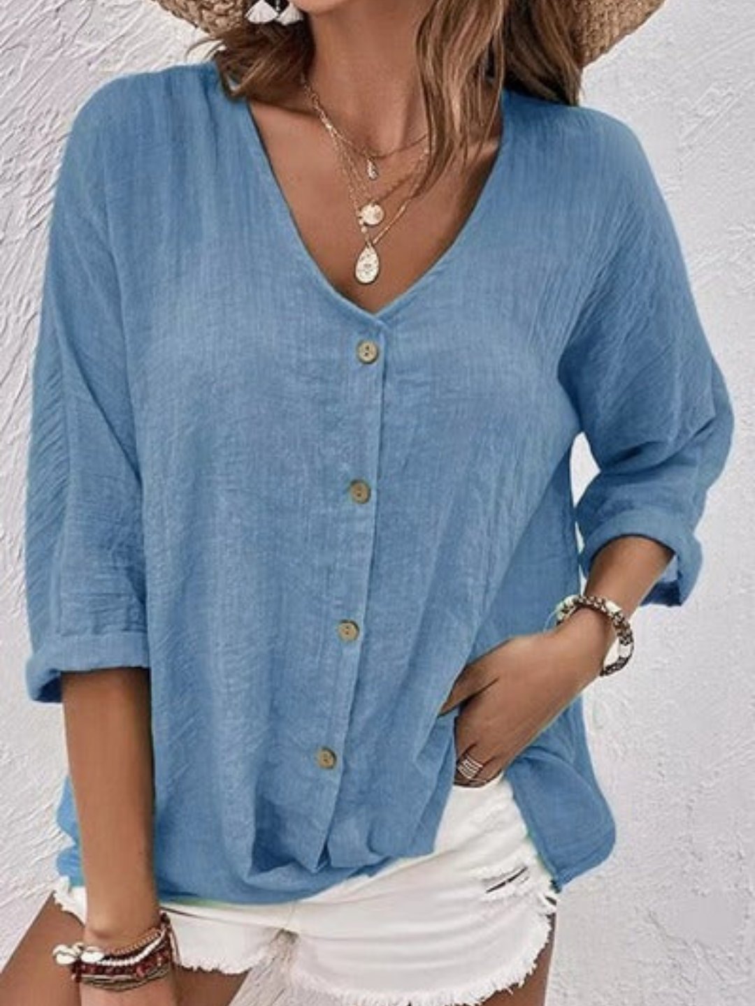 Relaxed women's 3/4 sleeve V-neck top, button-front, crinkle texture. Effortless casual chic for everyday.