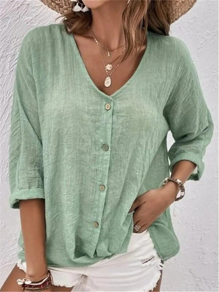 Lightweight women's 3/4 sleeve V-neck top, crinkle texture. Ideal for summer casual everyday wear.