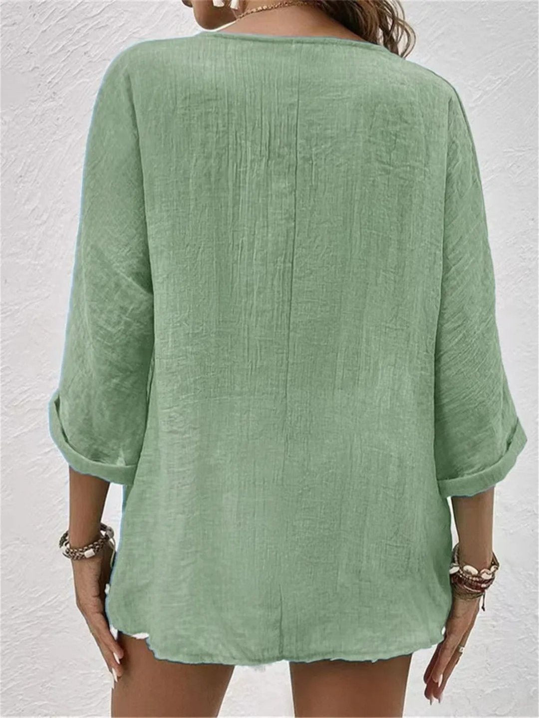 Versatile women's button-front V-neck top, crinkle texture, 3/4 sleeves. Great for casual & chic outfits.