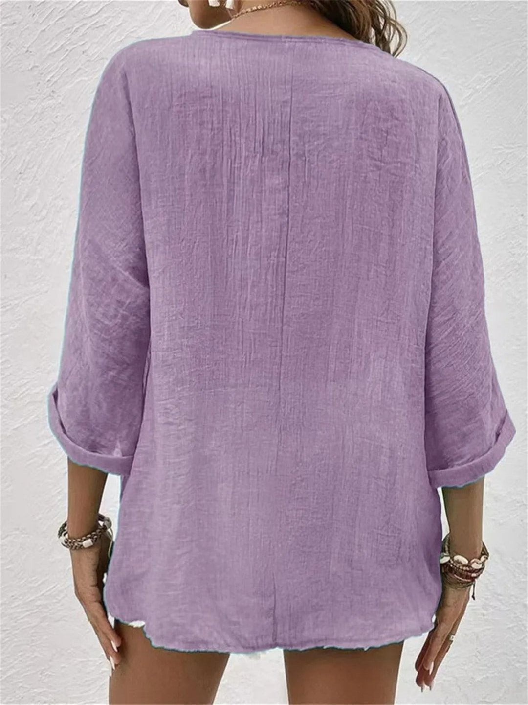 Front view of women's casual chic V-neck button-front top with crinkle texture & 3/4 sleeves.