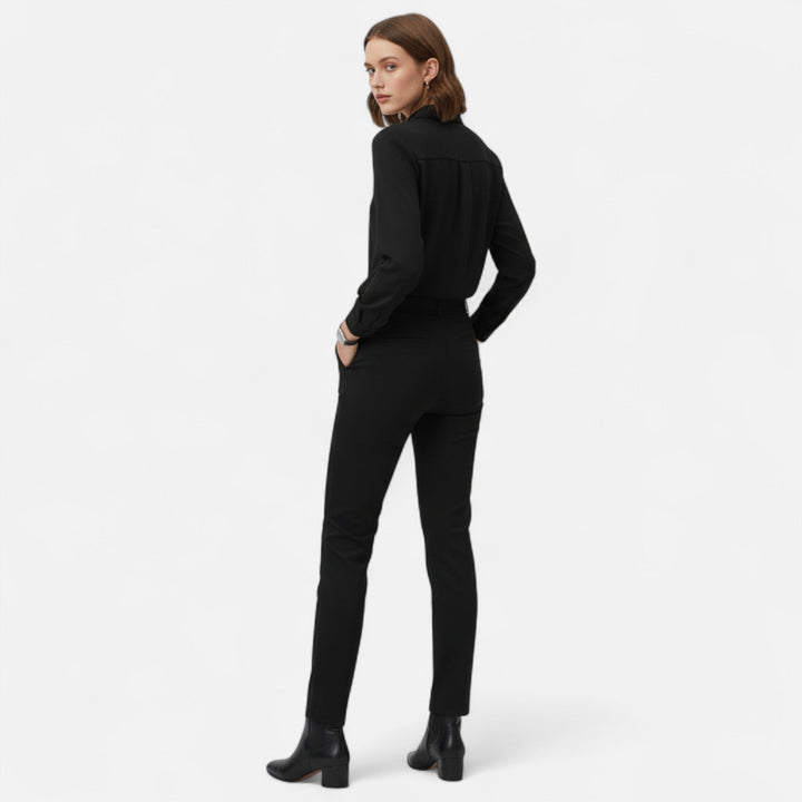Elegant women's V-neck blouse with button-up front. Versatile long-sleeve top for women's fashion.