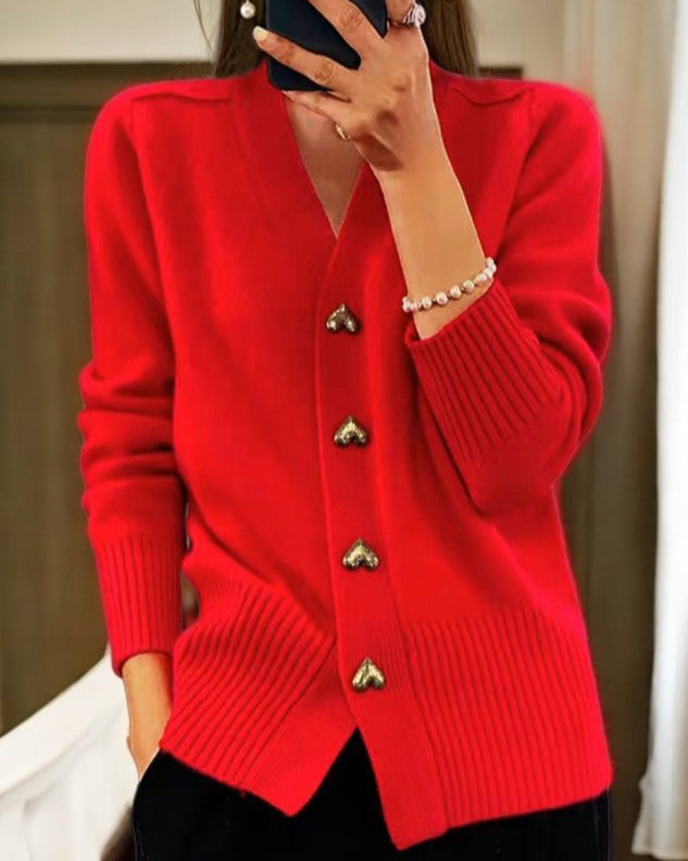 Chic women's long sleeve V-neck cardigan sweater. Button-down front with sweet heart buttons. Ideal layering piece.