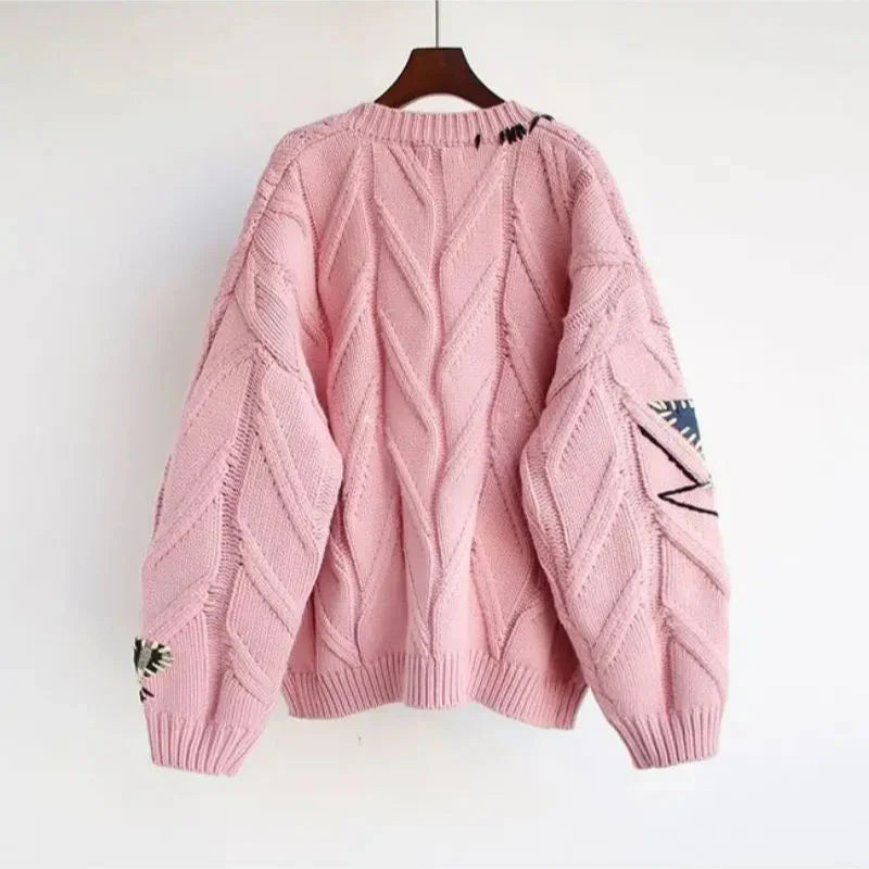 Women's V-Neck Cardigan with colorful patchwork embroidery. Cozy long-sleeve knit, perfect for autumn layering.