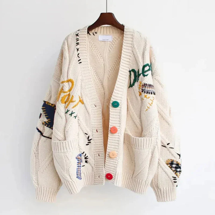 Versatile women's V-neck cardigan, featuring unique patchwork embroidery. Comfortable long sleeve for stylish layering.