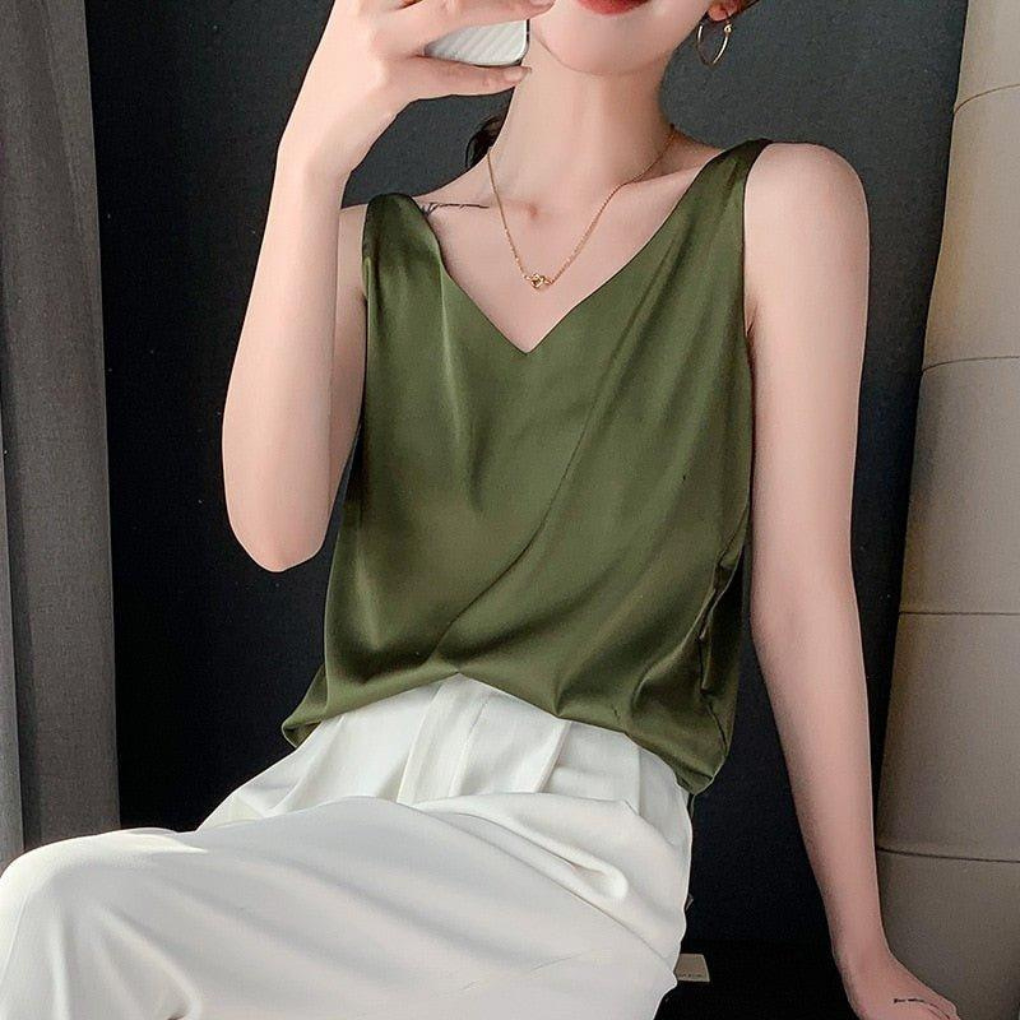 Women's V-neck draped tank top in a relaxed fit, perfect for casual or elegant all-season wear. Sleeveless and versatile.