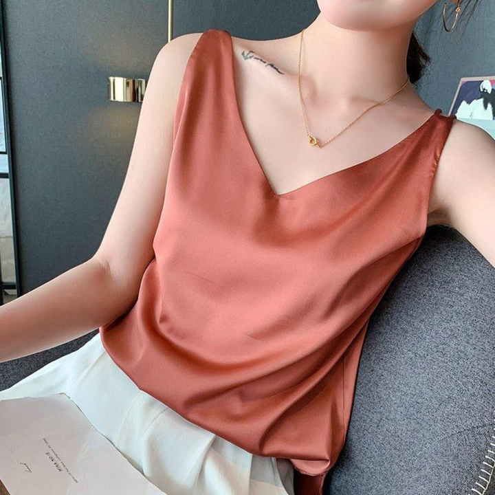 Relaxed fit women's V-neck tank top with elegant draping, a comfortable sleeveless top for all-season wear.