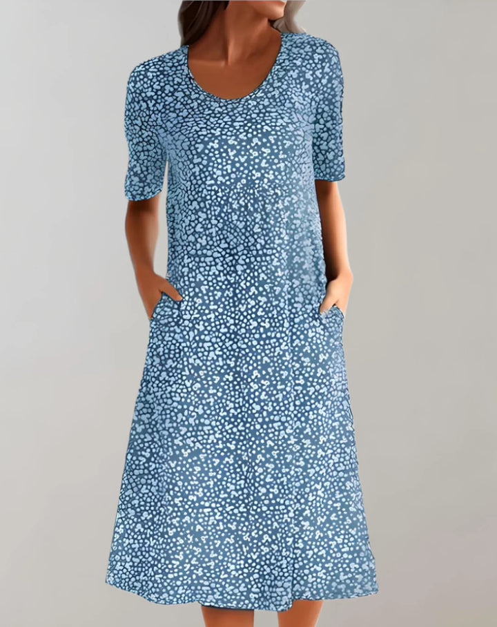 Colorful V-neck flowy summer dress for women, sleeveless, comfortable & relaxed fit for warm weather.