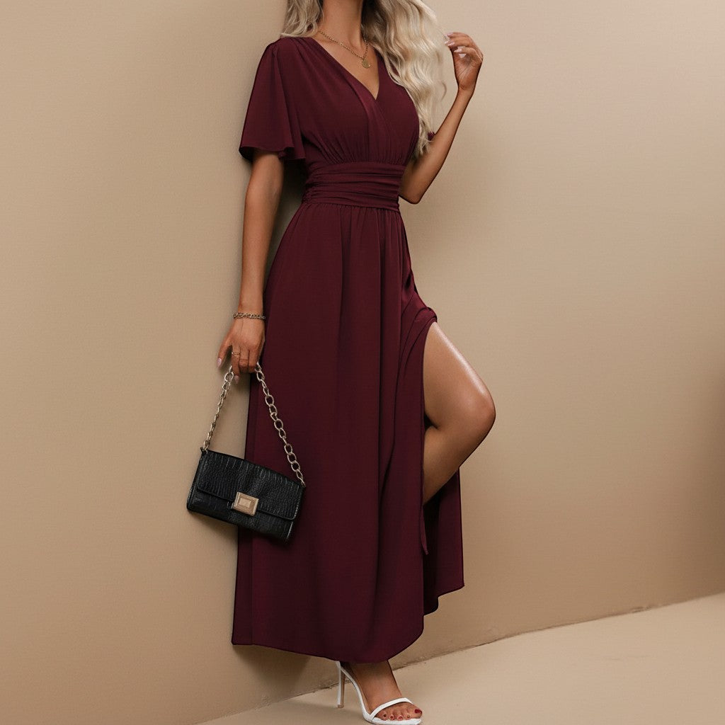Long women's dress with a flattering defined waist and V-neck, elegant for parties.