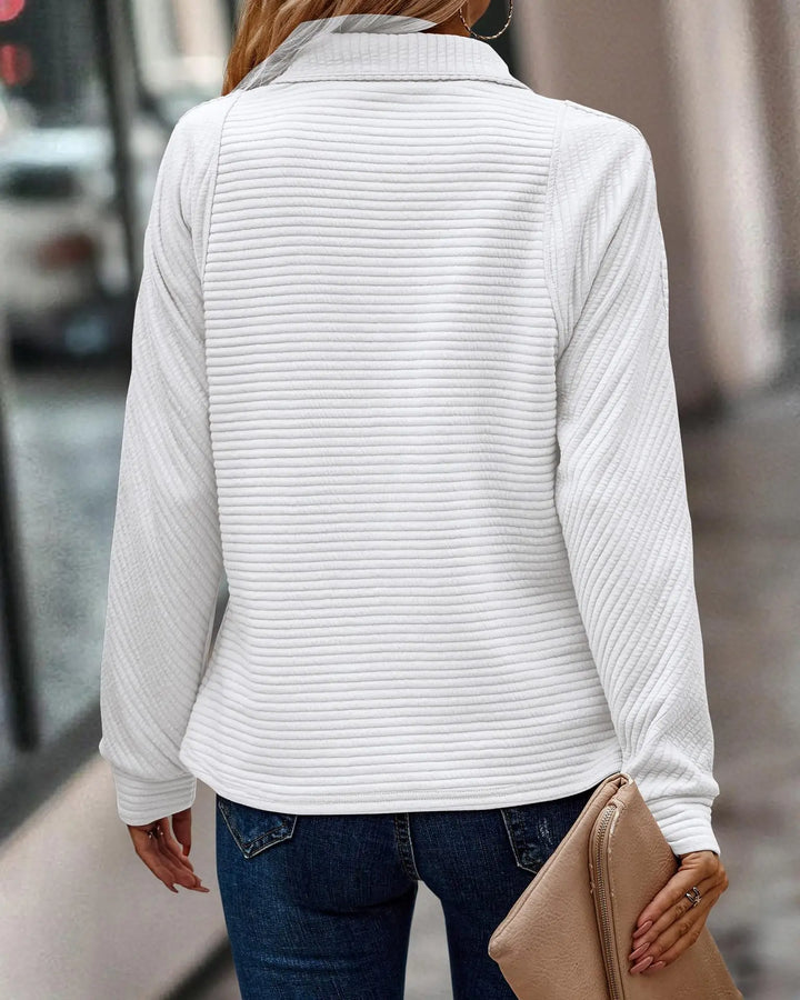 Modern women's V-neck half-zip pullover sweater. Elegant, comfortable casual jumper, ideal for layering.