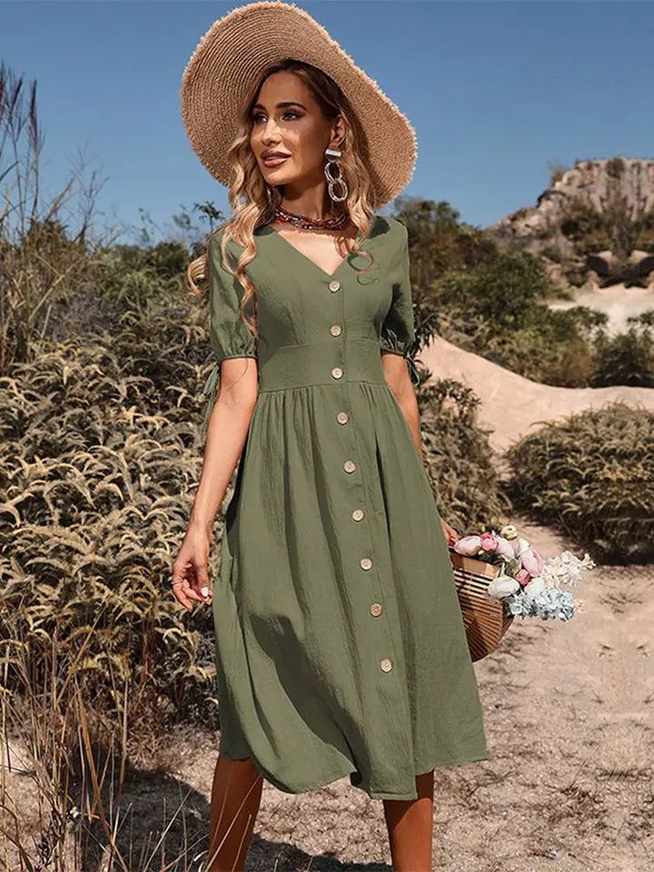Women's V-neck knee-length summer dress in apricot, short sleeve, relaxed fit for casual spring elegance.