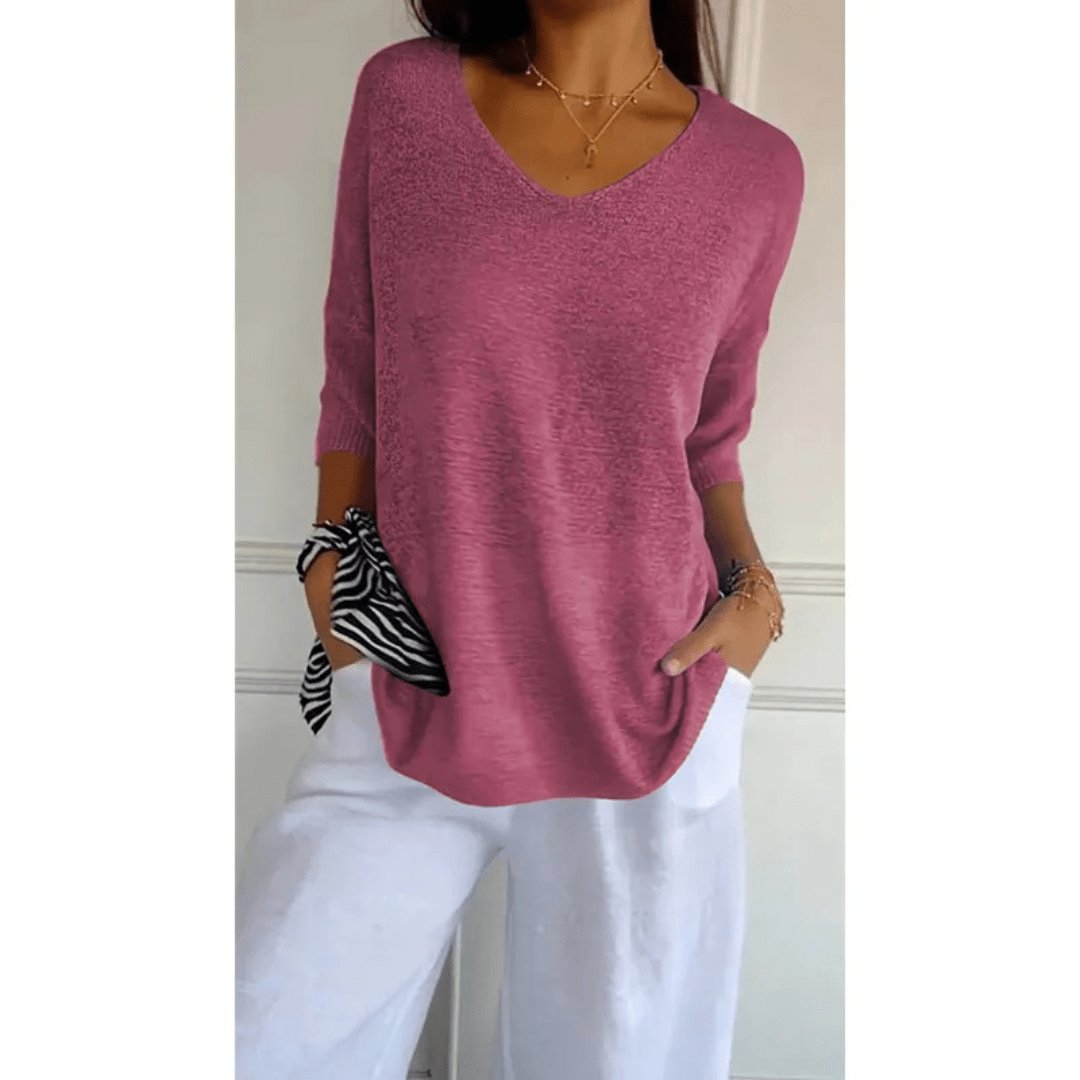 Effortless women's V-neck linen blouse with 3/4 sleeves. Relaxed fit, ideal for everyday spring fashion.