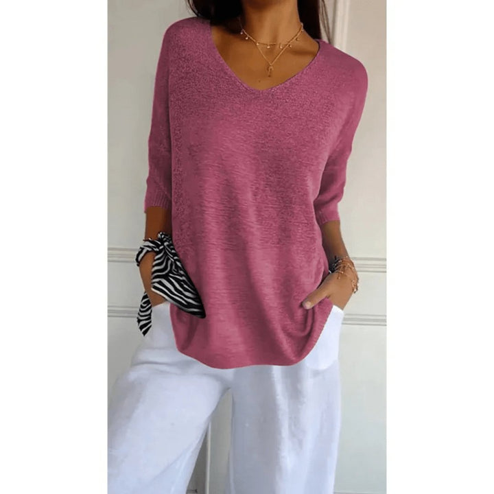 Effortless women's V-neck linen blouse with 3/4 sleeves. Relaxed fit, ideal for everyday spring fashion.