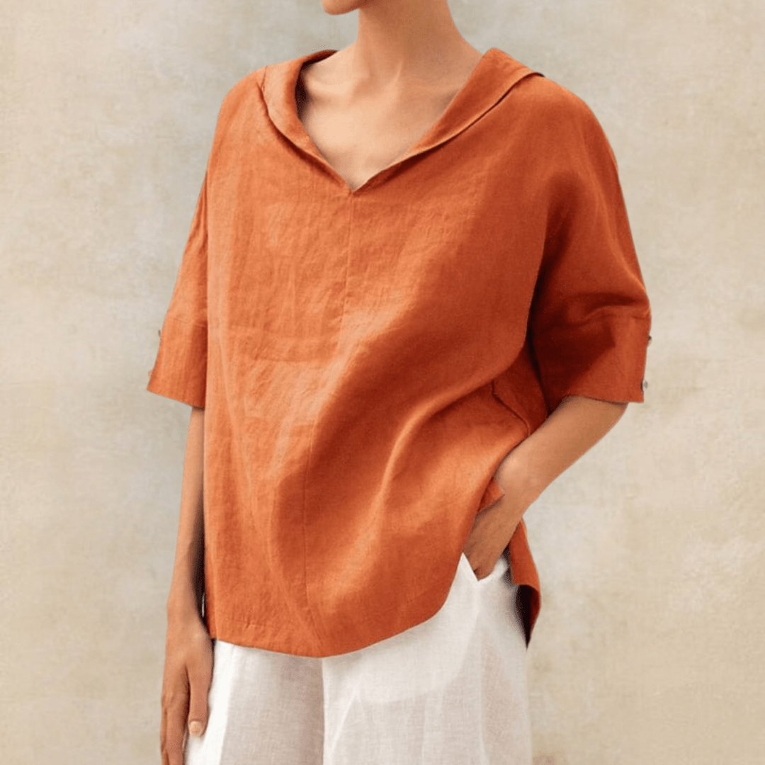 Relaxed fit women's linen tunic top, featuring a stylish V-neck and collar. Perfect for warm weather.