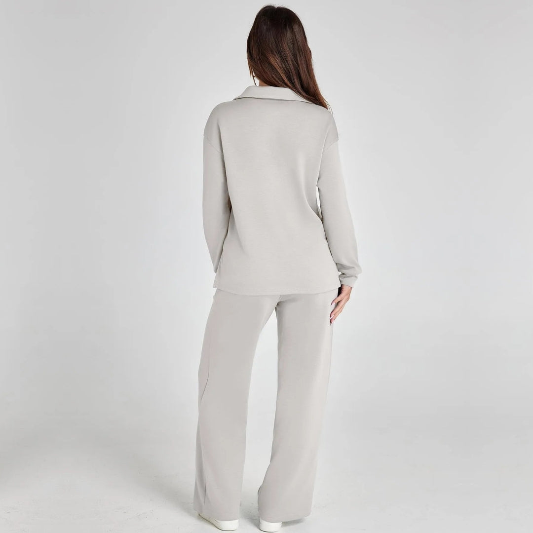 Full view of women's V-neck long sleeve loungewear set with flowing wide leg trousers.