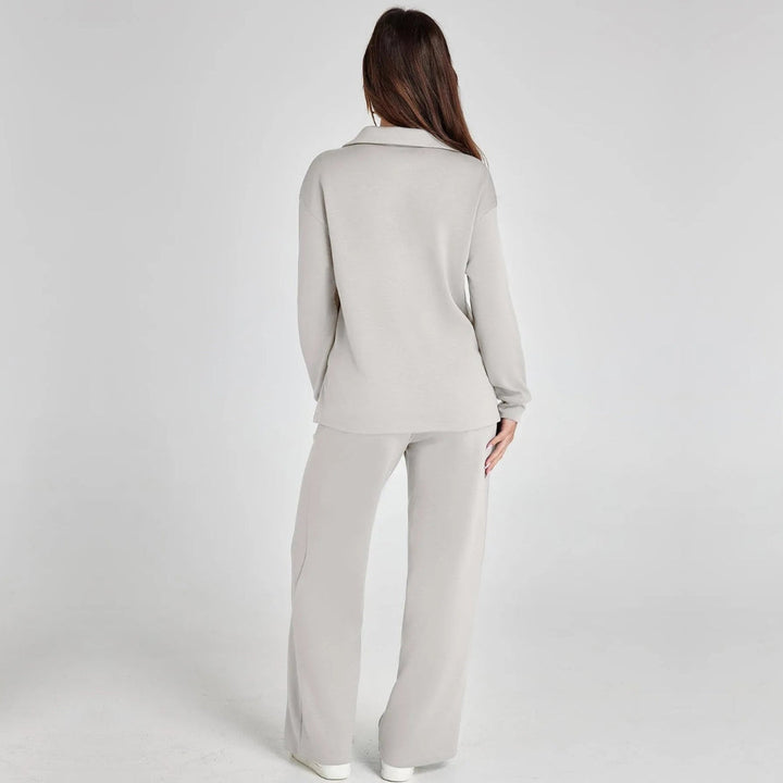 Full view of women's V-neck long sleeve loungewear set with flowing wide leg trousers.