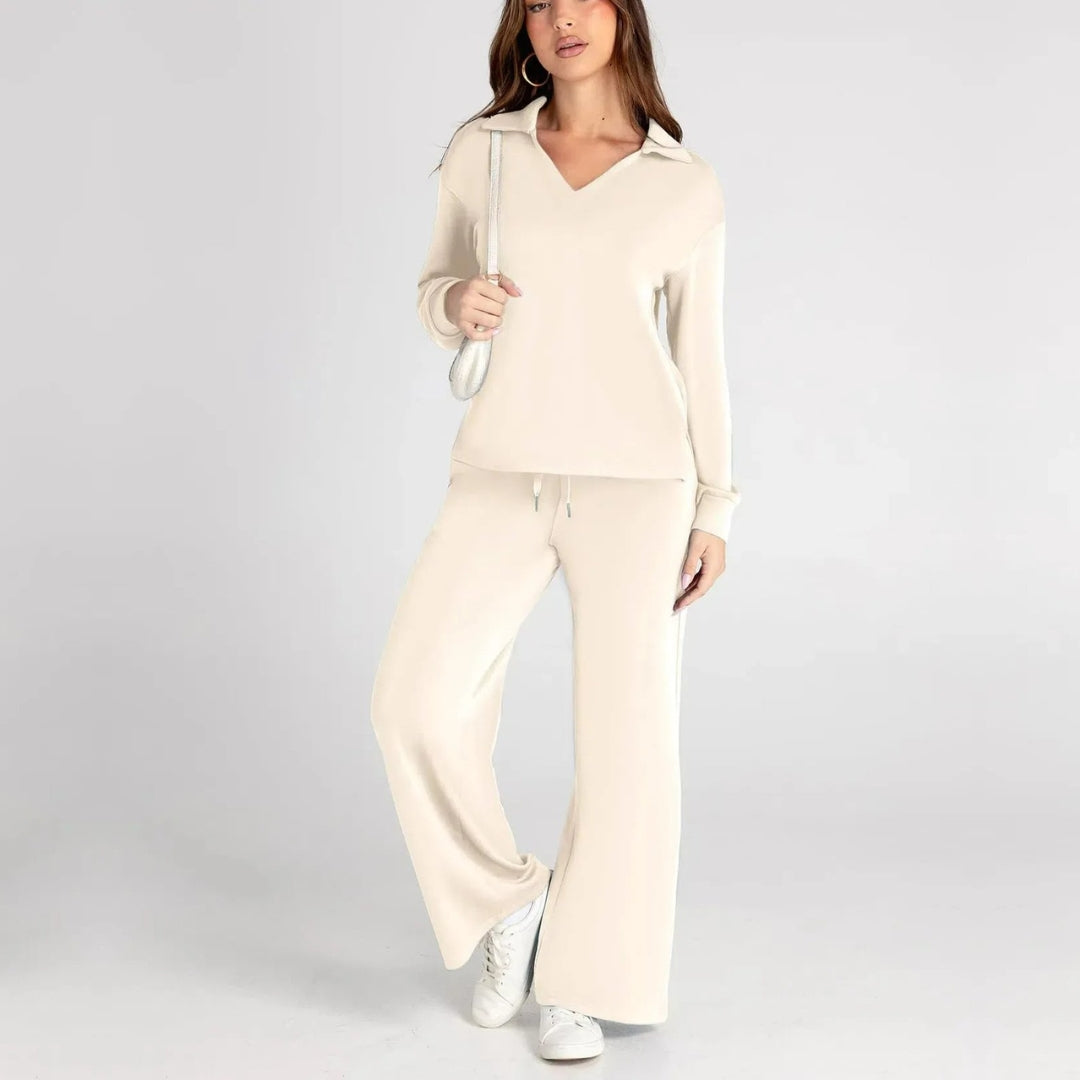 Soft fabric detail of women's V-neck long sleeve loungewear set, including wide leg trousers.