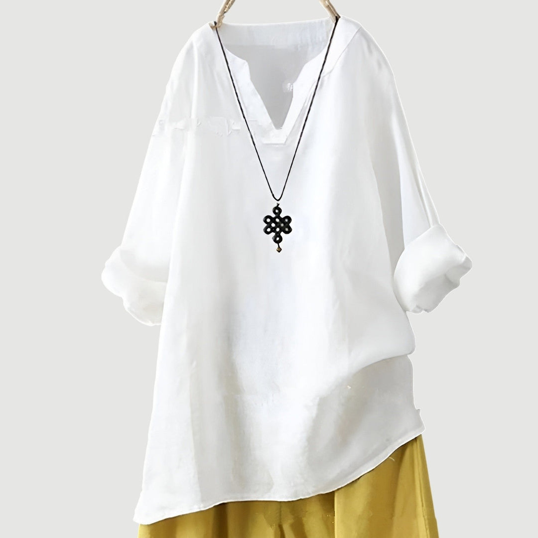 Relaxed fit women's v-neck tunic in breathable linen. Stylish long sleeve top for comfortable summer and casual wear.