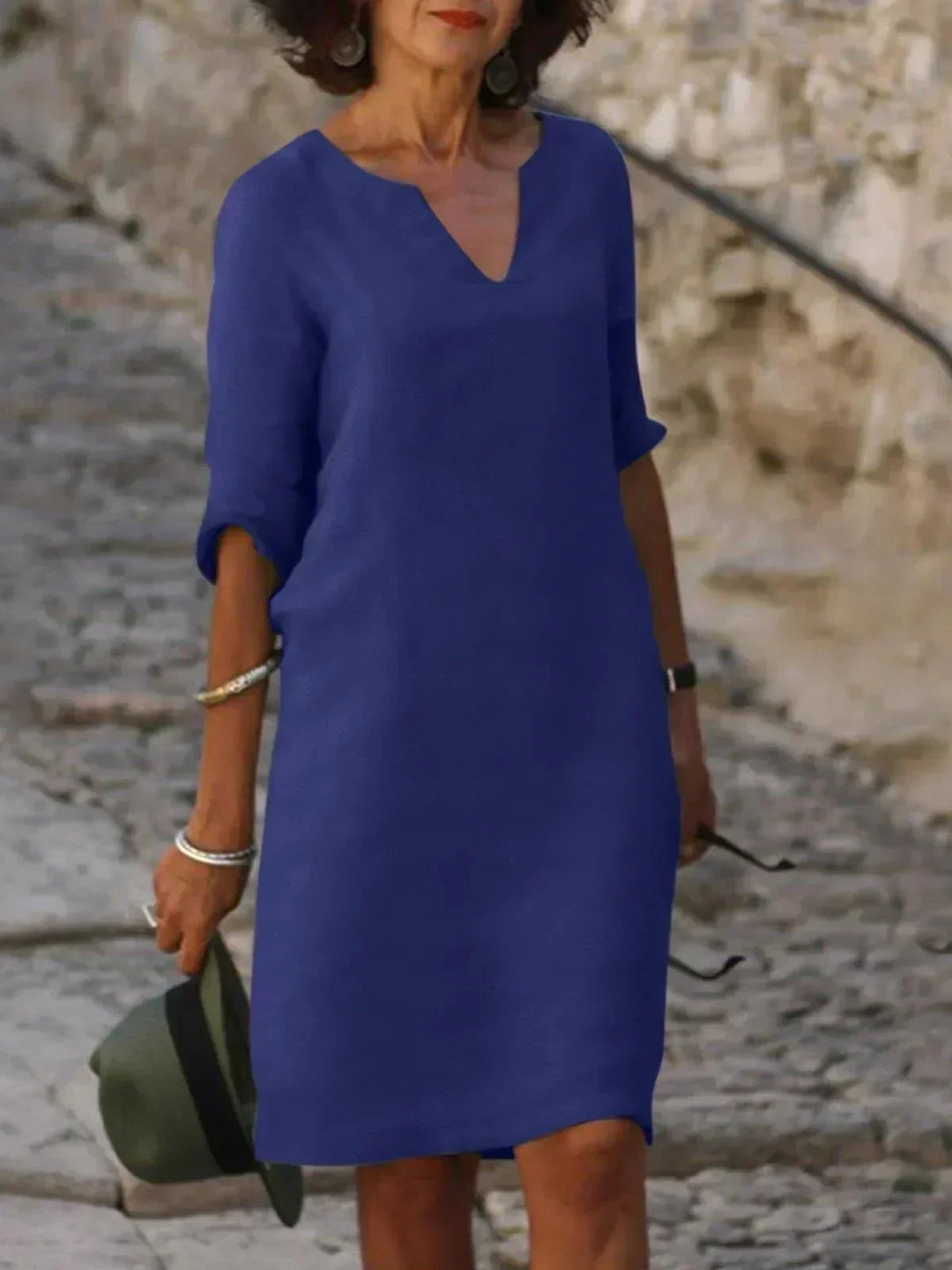 Classic V-neck midi dress for women, with 3/4 sleeves and pockets, offering an elegant and comfortable look.