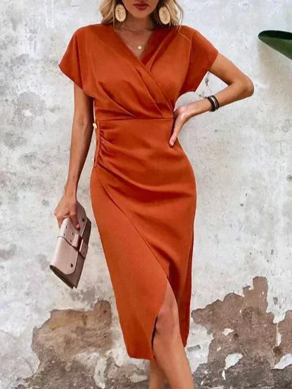 Elegant orange V-neck midi dress for women, featuring a stylish split. Ideal summer party or wedding guest attire.
