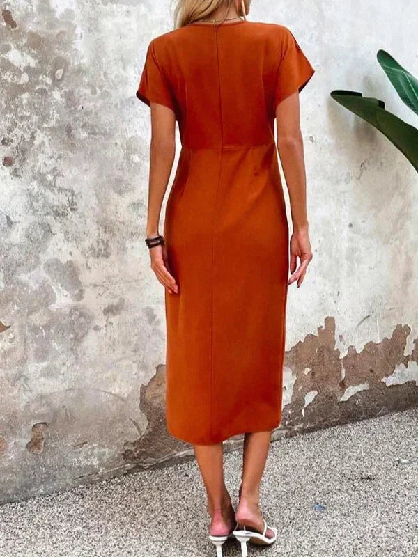 Orange V-neck midi summer dress with a graceful split. A comfortable & elegant choice for women's occasion wear.