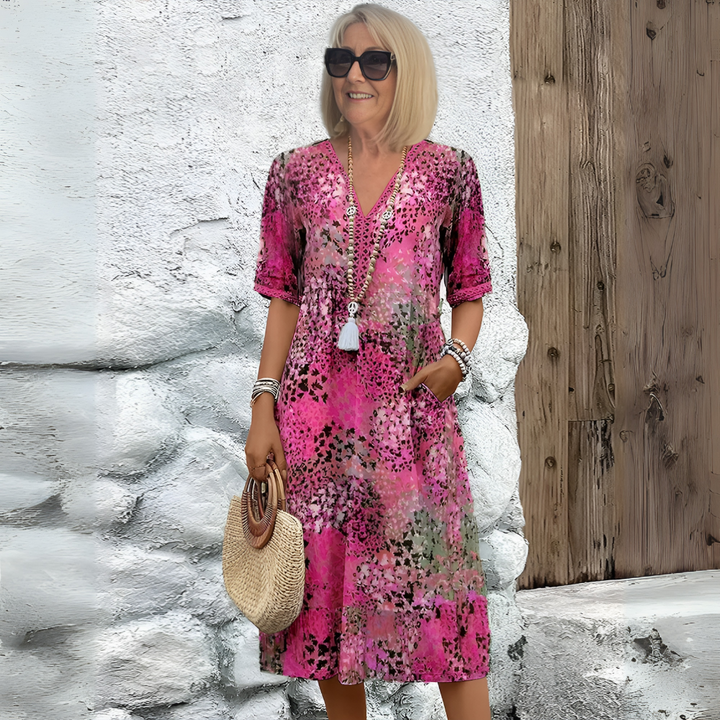 Versatile women's printed midi dress, V-neck, relaxed fit. Ideal for day or evening, casual to elegant.