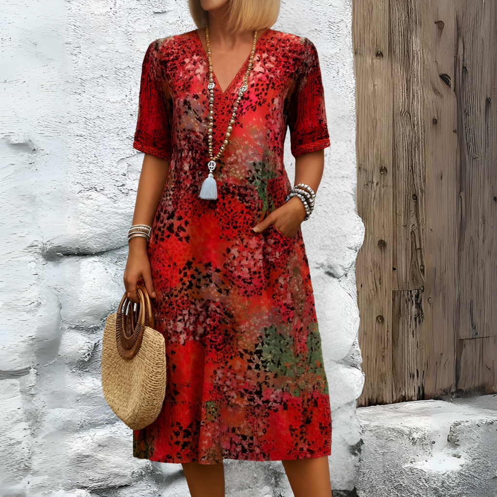 Casual yet elegant women's V-neck midi dress with abstract print & relaxed fit, perfect for summer outings.