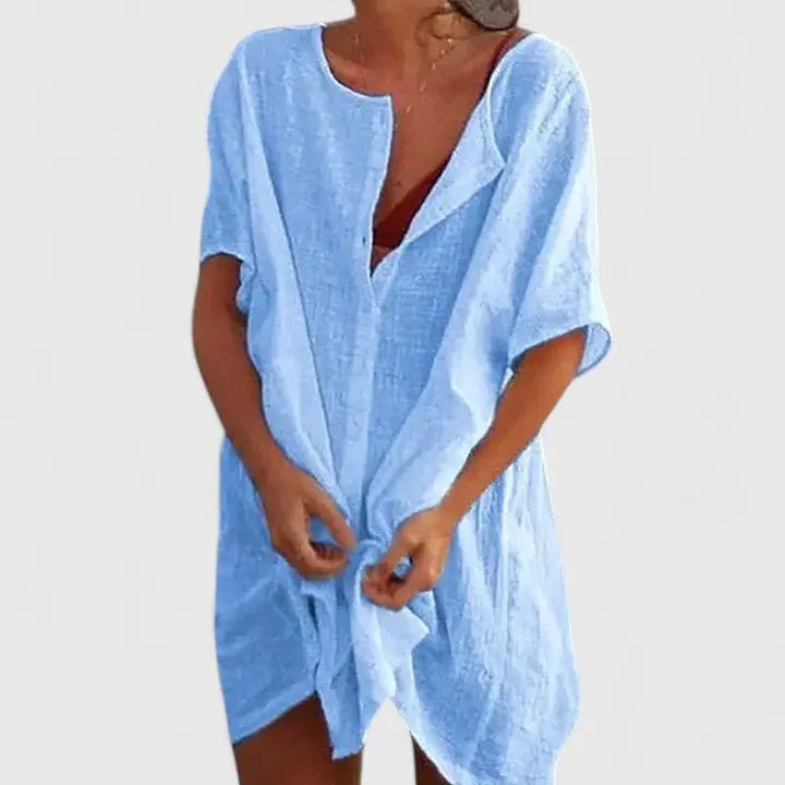 Elegant V-neck summer tunic dress, ideal for resort wear, beach days, or casual outings.