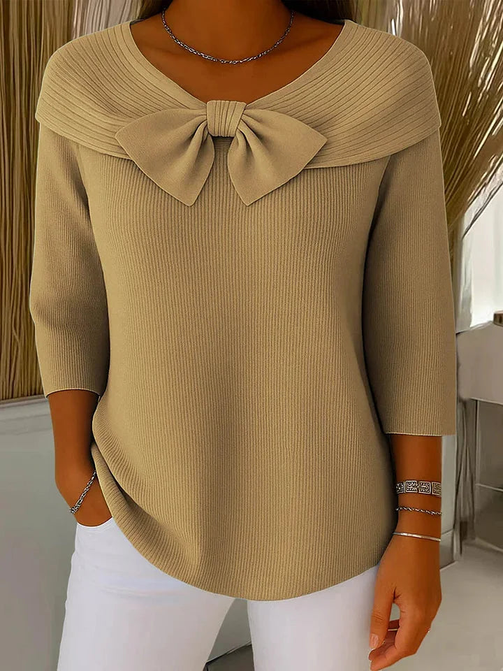 Chic women's V-neck ribbed knit sweater featuring a delicate bow detail and stylish 3/4 sleeves.