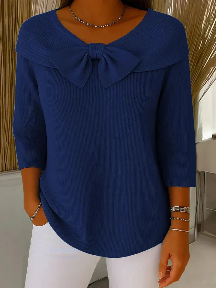 Ribbed knit V-neck sweater for women, featuring a flattering 3/4 sleeve and pretty bow detail.