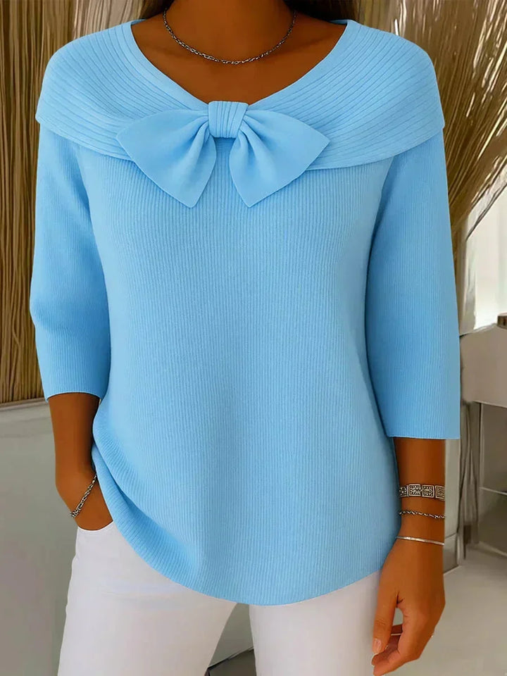 Fashionable women's sweater: V-neck ribbed knit with stylish 3/4 sleeves and a cute bow accent.
