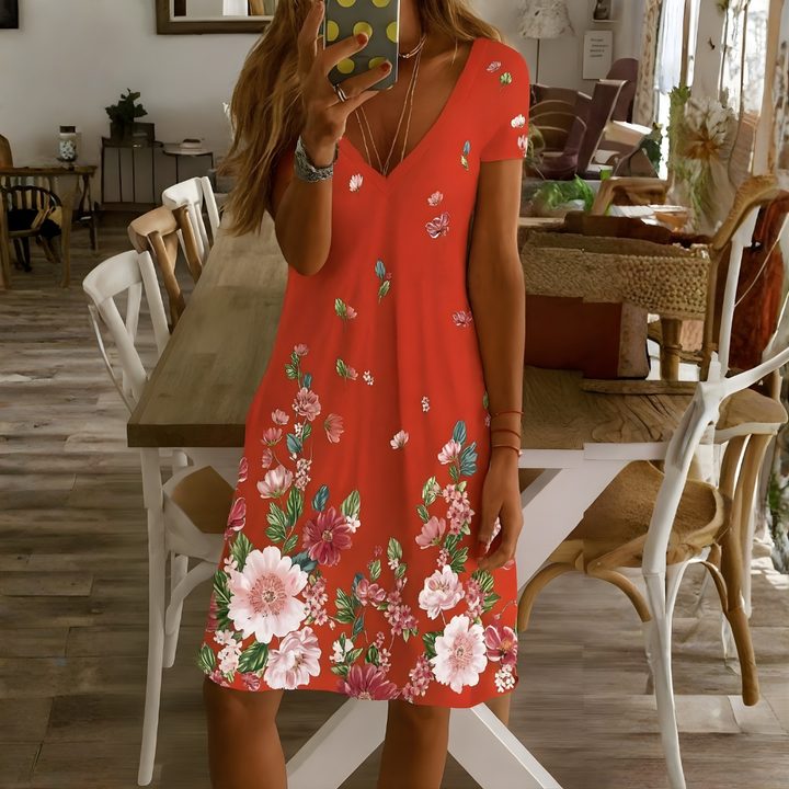 Bohemian women's dress with vibrant mandala print. Relaxed fit, V-neck, short-sleeve for daily summer outfits.