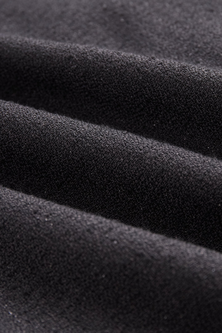 Close-up: button detail on a women's V-neck sleeveless vest, part of an elegant maxi skirt set.