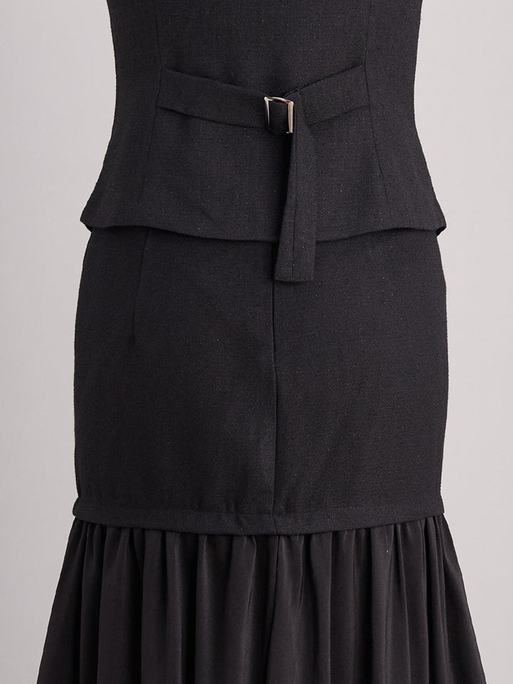 Woman in a versatile V-neck sleeveless vest and maxi skirt matching set, perfect for day or night.