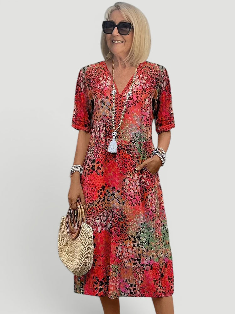 Casual women's summer V-neck midi dress, relaxed fit, lightweight, often includes convenient pockets.