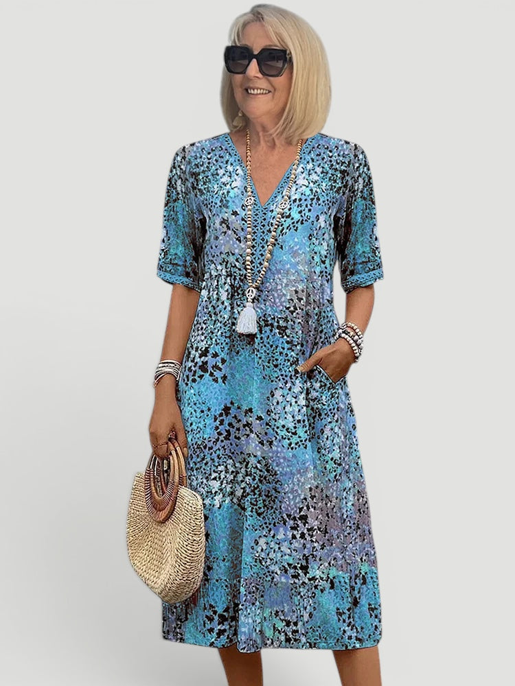Beautiful women's V-neck A-line midi dress, lightweight & breathable, perfect for warm weather and relaxed style.