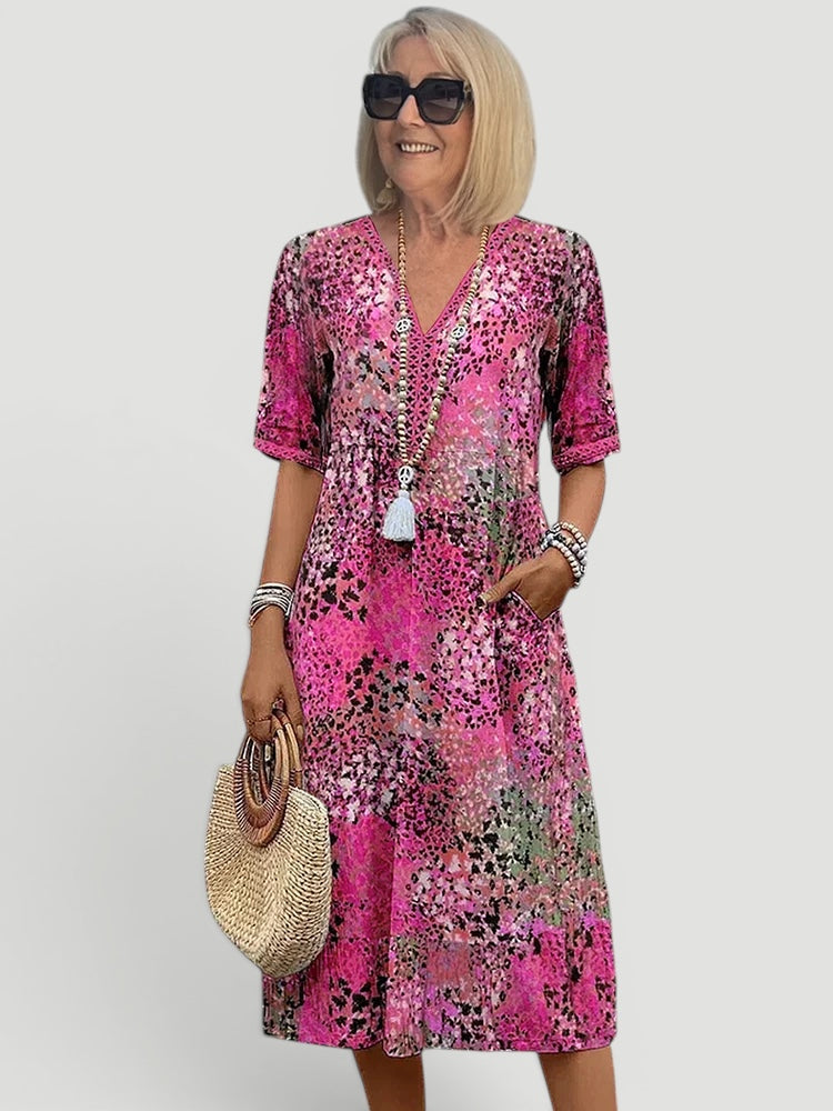 Relaxed fit women's V-neck midi dress, lightweight summer style, offers a chic and comfortable casual look.