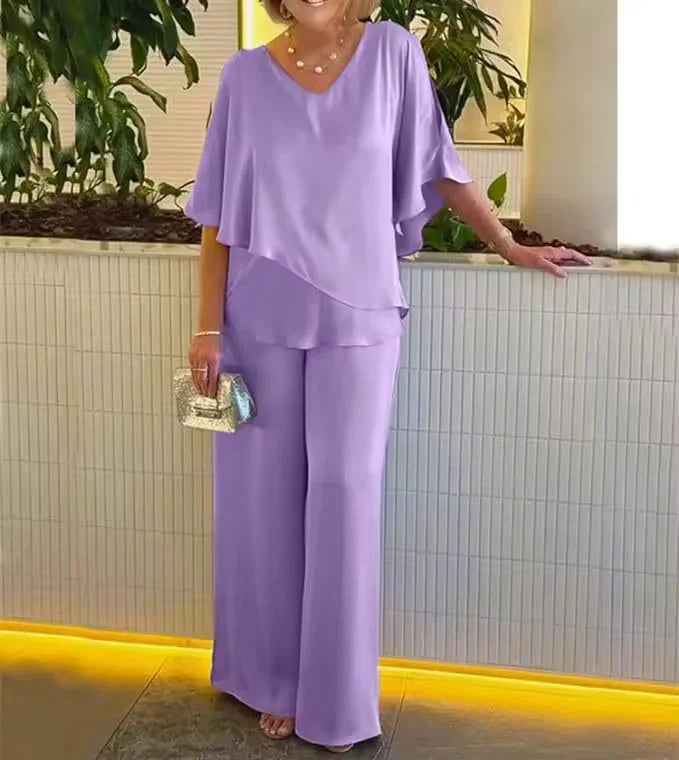 Casual chic women's two-piece set featuring V-neck top & wide-leg pants. Perfect for spring/summer resort wear.