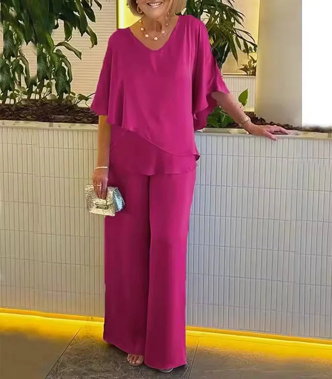 Modern women's matching set: Flowy wide-leg pants paired with a chic V-neck top. Casual yet elegant ladies outfit.