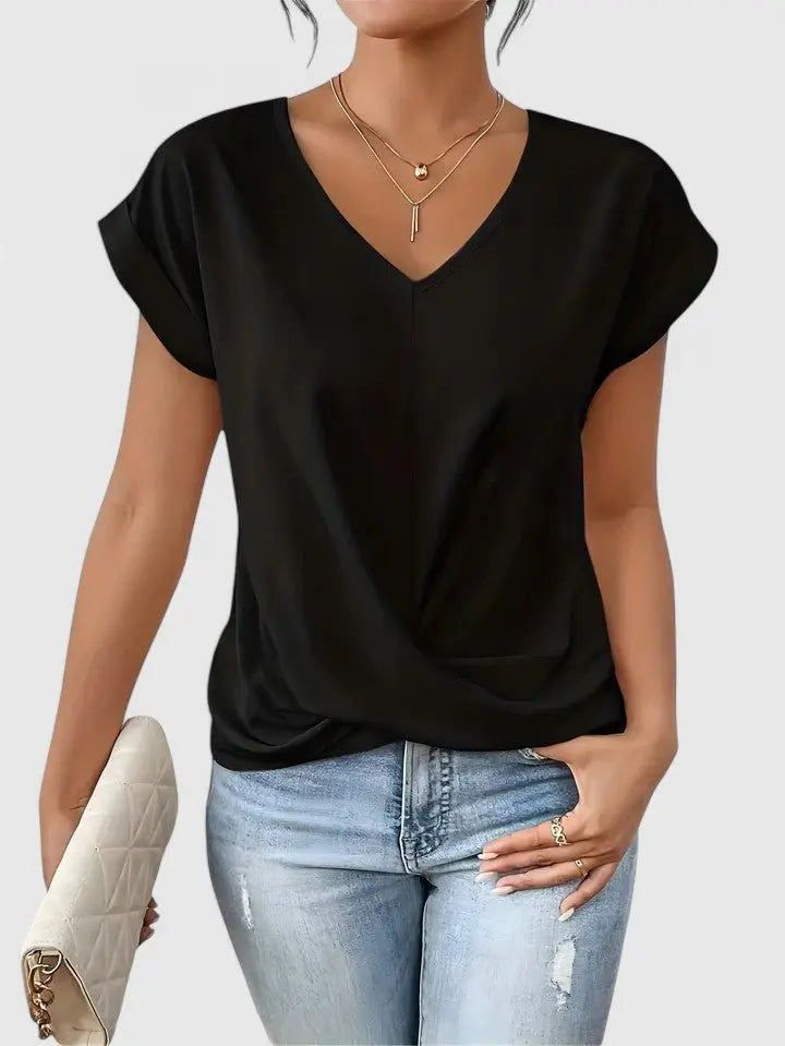 Comfortable women's short sleeve V-neck top with a relaxed fit and elegant twist front detail.