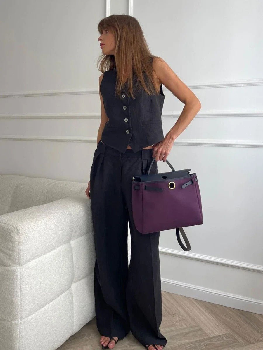 Comfortable women's two-piece casual set featuring a V-neck top and high-waisted relaxed fit trousers.
