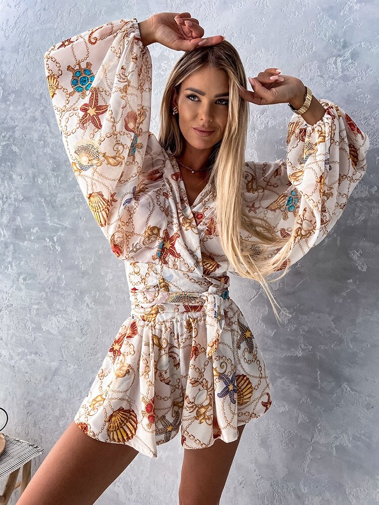 Coordinated V-neck short set featuring a flattering wrap front top, tie waist & trendy balloon sleeves.