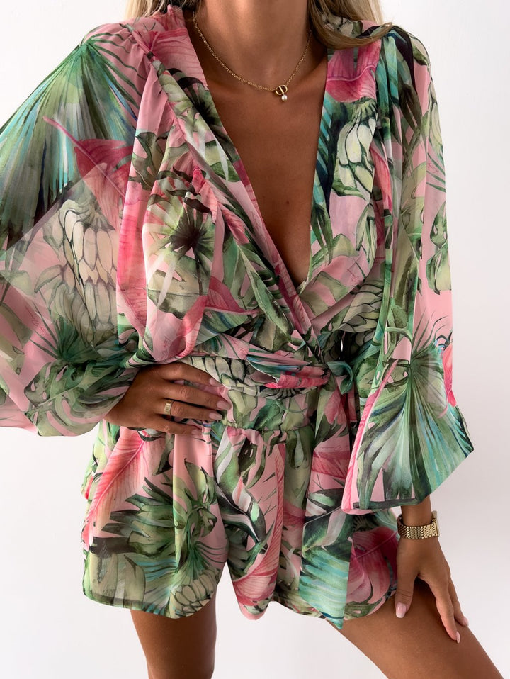 Women's V-neck top & shorts set, with a chic wrap front, tie-waist detail & stylish balloon sleeves.