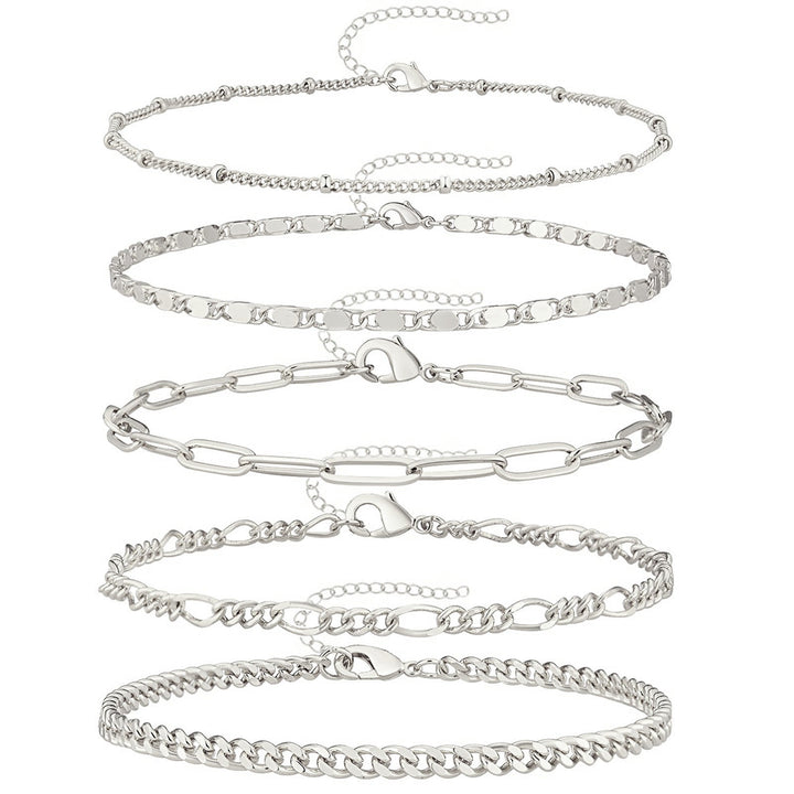 Multi-style women's adjustable anklet set. Gold and silver-tone versatile ankle bracelets for diverse fashion looks.