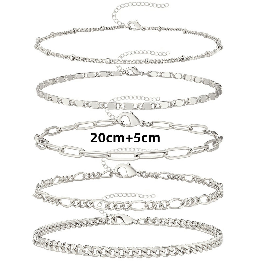 Set of women's adjustable anklets with delicate chains & charms. Versatile gold & silver-tone ankle jewelry.