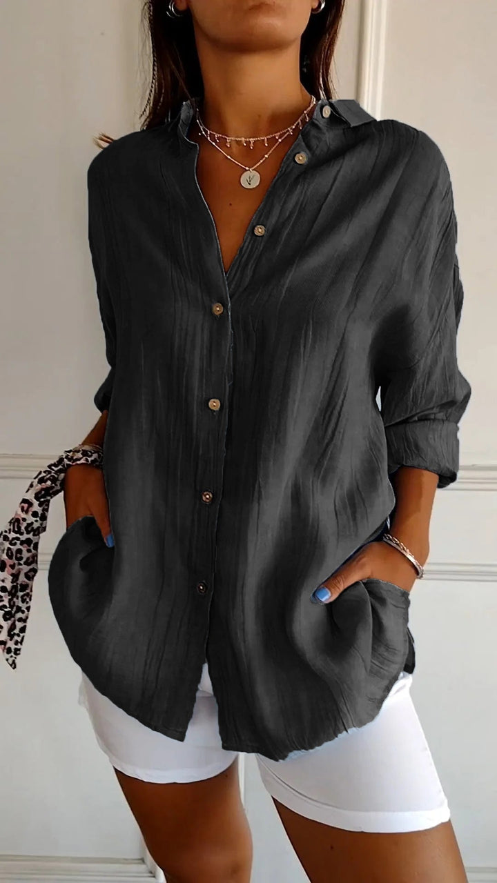 Chic women's long sleeve button-down blouse, ideal for office or casual tops.
